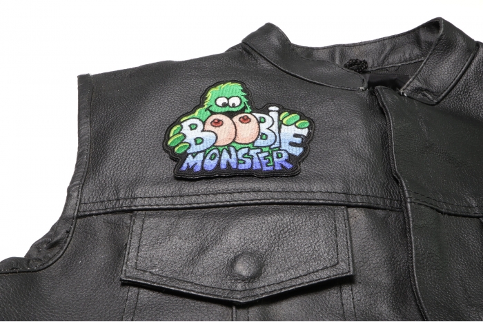 Boobie Monster Patch - 4x4 inch. Embroidered Iron on Patch shown on leather vest