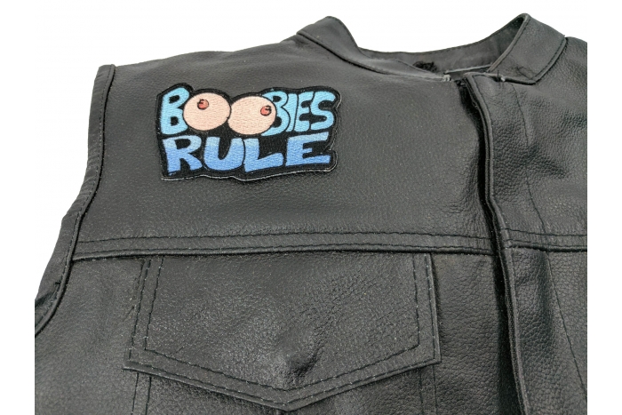Boobies Rule Fun Patch - 4x2.4 inch. Embroidered Iron on Patch shown on leather vest
