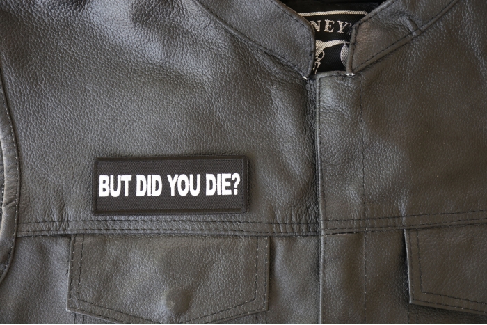 But Did you Die Patch - 4x1.5 inch - Embroidered Iron on Patch shown on leather vest