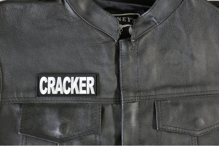 Cracker Patch - 4x1.5 inch - Embroidered Iron on Patch shown on leather vest