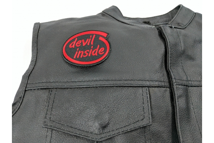 Devil Inside Patch - 3x2.5 inch. Embroidered Iron on Patch shown on leather vest