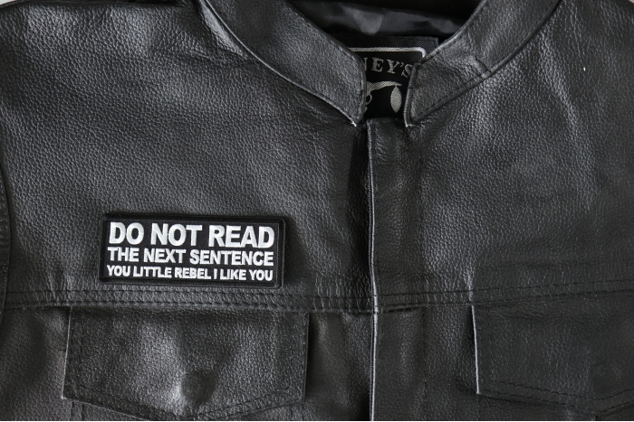 Do No Read The Next Sentence You Little Rebel I Like You Patch - 4x1.5 inch - Embroidered Iron on Patch shown on leather vest