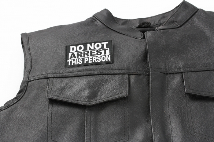 Do Not Arrest This Person Patch - 3.25x2.25 inch. Embroidered Iron on Patch shown on leather vest
