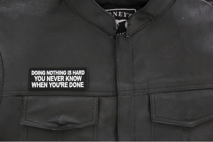 Doing Nothing is Hard, You never know when you're done Patch - 4x1.5 inch - Embroidered Iron on Patch shown on leather vest