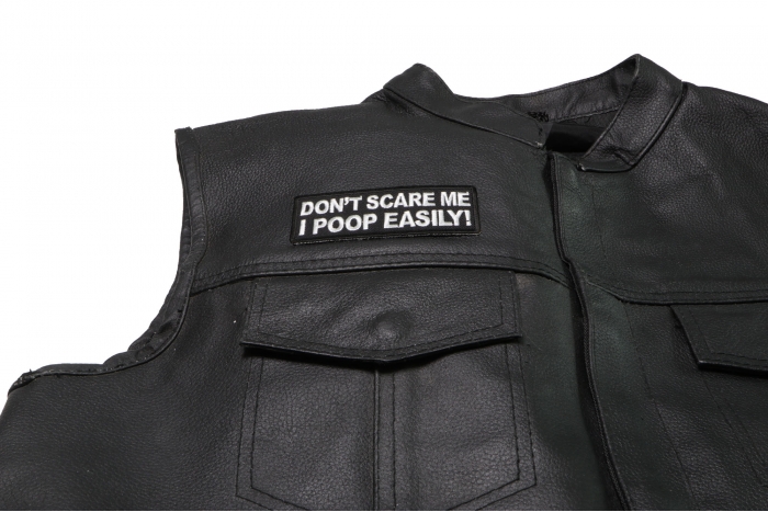 Don't Scare me I Poop Easily Patch - 4x1.5 inch. Embroidered Iron on Patch shown on leather vest