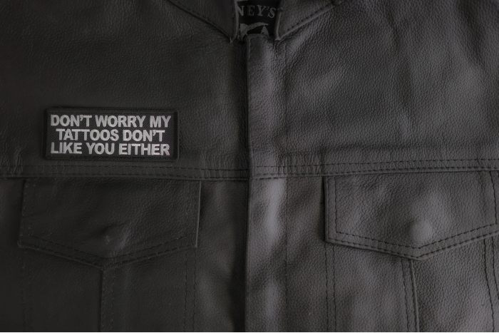 Don't Worry My Tattoos Dont Like You Either Patch shown on leather vest