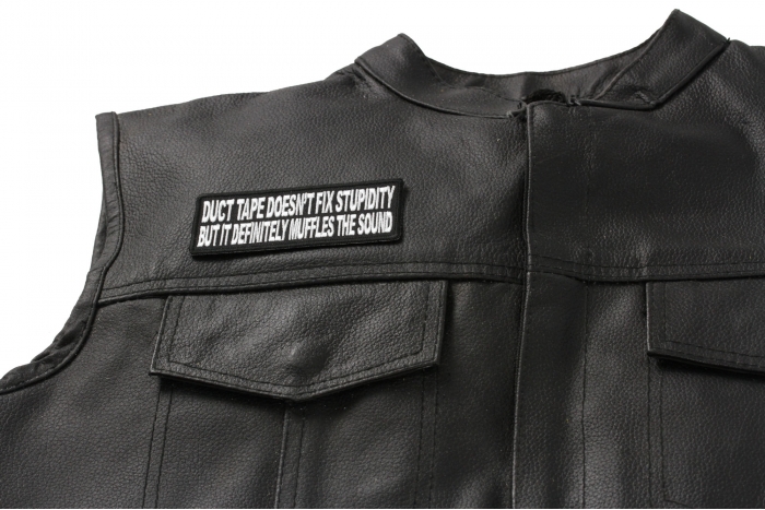 Duct Tape Doesn't Fix Stupidity It Muffles The Sound Fun Patch - 4x1.5 inch. Embroidered Iron on Patch shown on leather vest