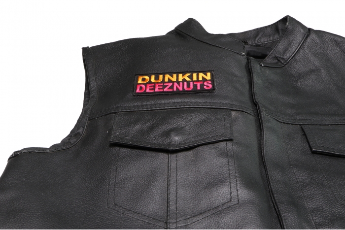 Dunkin Deeznuts Patch - 4x1.5 inch. Embroidered Iron on Patch shown on leather vest
