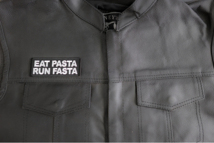 Eat Pasta Run Fasta Patch shown on leather vest