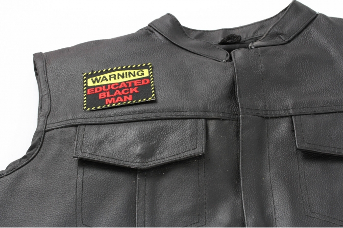 Warning Educated Black Man Patch - 3x2.5 inch. Embroidered Iron on Patch shown on leather vest