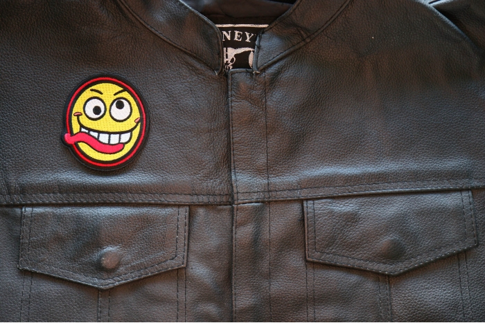 Funny Face Iron on Patch shown on leather vest