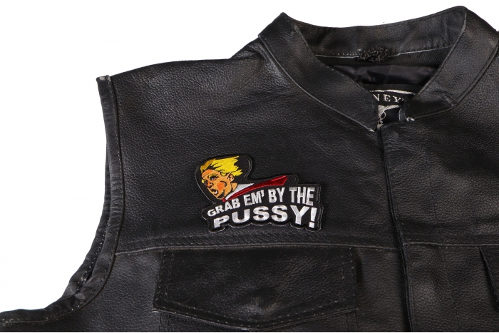 Grab Em by The Pussy Trump Patch - 3.5x3.3 inch. Embroidered Iron on Patch shown on leather vest