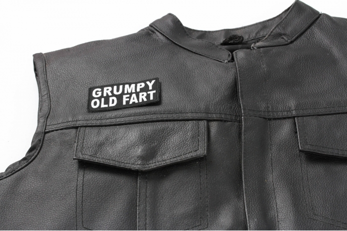 Grumpy Old Fart Patch - 3x1.5 inch. Embroidered Iron on Patch shown on leather vest