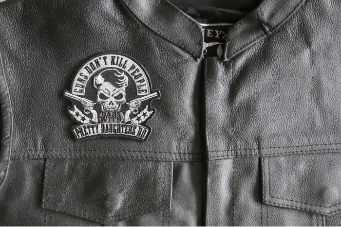 Guns Don't Kill People Dads with Pretty Daughters Do Iron on Skull Pistols Patch - 4x3.7 inch - Embroidered Iron on Patch shown on leather vest