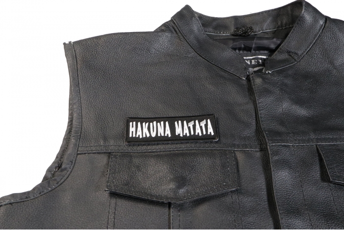 Hakuna Matata Patch - 4x1.5 inch. Embroidered Iron on Patch shown on leather vest