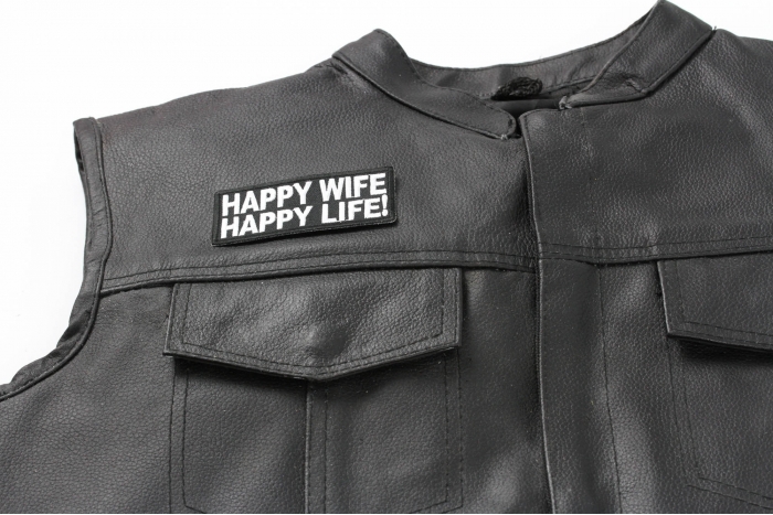 Happy Wife Happy Life Patch - 4x1.5 inch. Embroidered Iron on Patch shown on leather vest