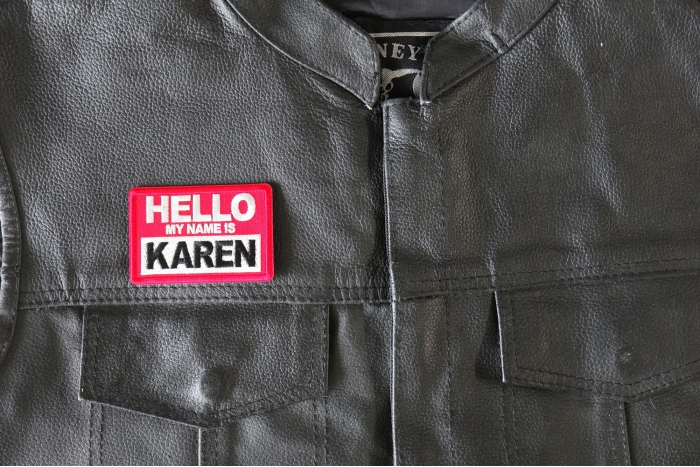 Hello My Name is Karen Patch - 3x2 inch - Embroidered Iron on Patch shown on leather vest