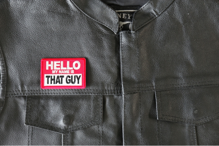 Hello My Name is That Guy Patch - 3x2 inch - Embroidered Iron on Patch shown on leather vest