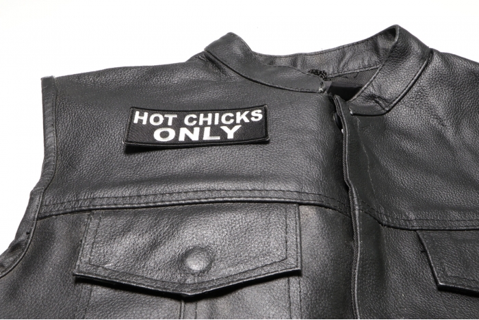 Hot Chicks Only Patch - 4x1.5 inch. Embroidered Iron on Patch shown on leather vest
