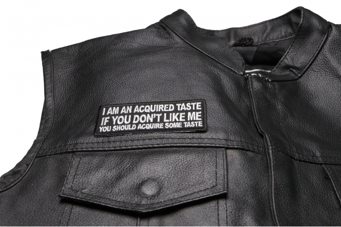 I am an Acquired Taste If You Don't Like Me You Should Acquire Some Taste Patch - 4x1.5 inch. Embroidered Iron on Patch shown on leather vest