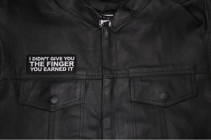 I didn't Give you the Finger You Earned it Patch shown on leather vest
