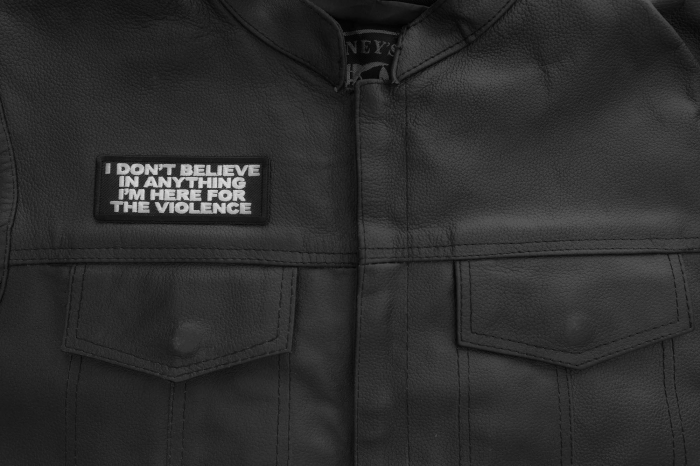 I don't believe in anything I'm here for the violence Patch shown on leather vest