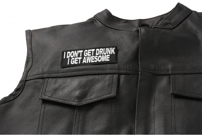 I Don't Get Drunk I Get Awesome Funny Saying Patch - 4x1.5 inch. Embroidered Iron on Patch shown on leather vest