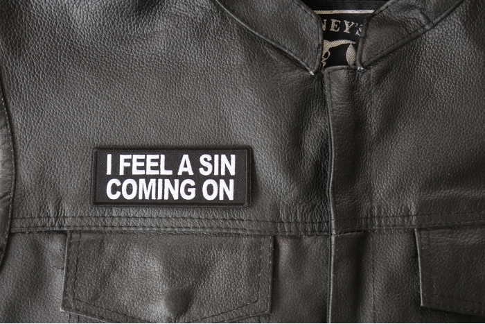 I Feel a Sin Coming On Patch - 4x1.5 inch - Embroidered Iron on Patch shown on leather vest