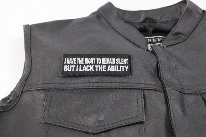 I Have The Right to Remain Silent But I Lack The Ability Patch - 4x1.5 inch. Embroidered Iron on Patch shown on leather vest