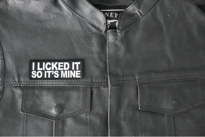 I licked it so It's mine Patch - 4x1.5 inch - Embroidered Iron on Patch shown on leather vest