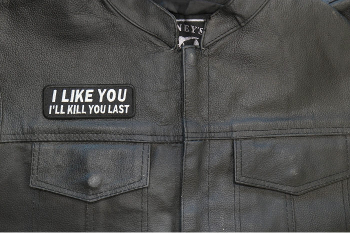 I Like You I Will Kill You Last Patch - 4x1.75 inch. Embroidered Iron on Patch shown on leather vest