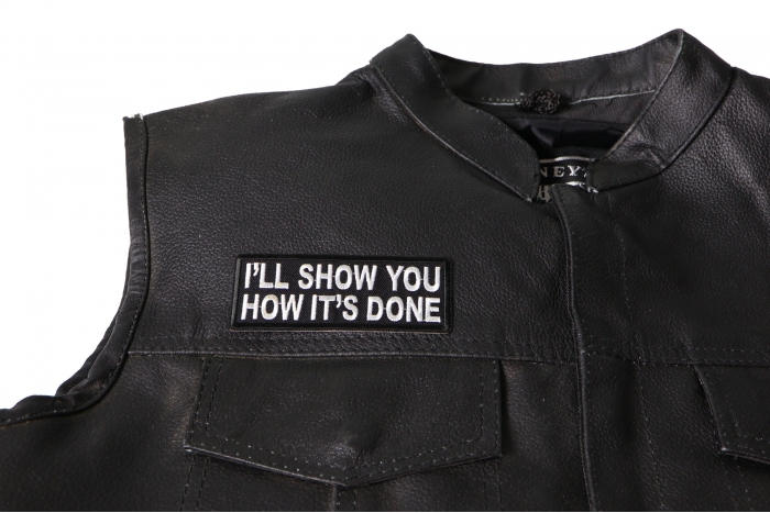 I'll Show You How It's Done Patch - 4x1.5 inch. Embroidered Iron on Patch shown on leather vest