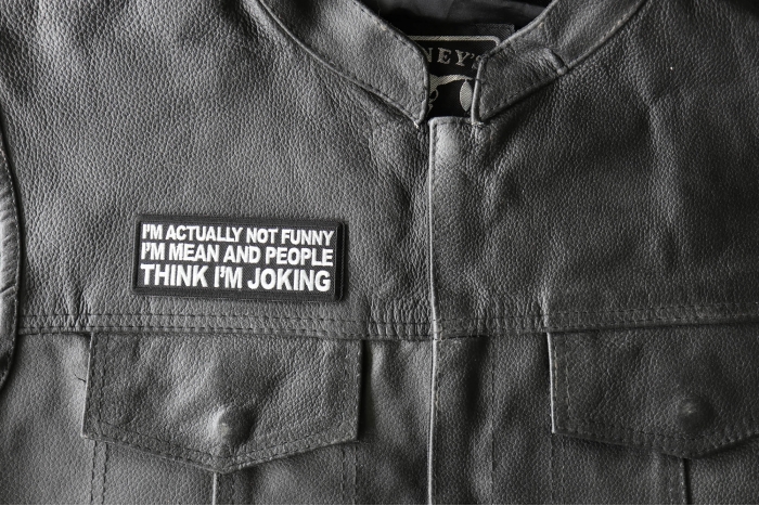I'm Actually Not Funny I'm Mean and People Think I'm Joking Patch - 4x1.5 inch - Embroidered Iron on Patch shown on leather vest