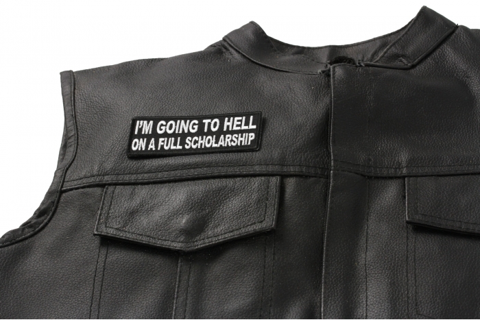 I'm Going to Hell On A Full Scholarship Patch - 4x1.5 inch. Embroidered Iron on Patch shown on leather vest
