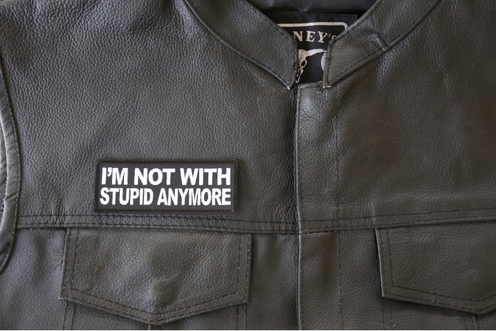 I'm Not with Stupid Anymore Patch - 4x1.5 inch. Embroidered Iron on Patch shown on leather vest