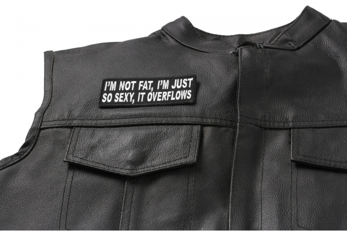 I'm Not Fat I'm Just So Sexy It Overflows Patch - 4x1.5 inch. Embroidered Iron on Patch shown on leather vest