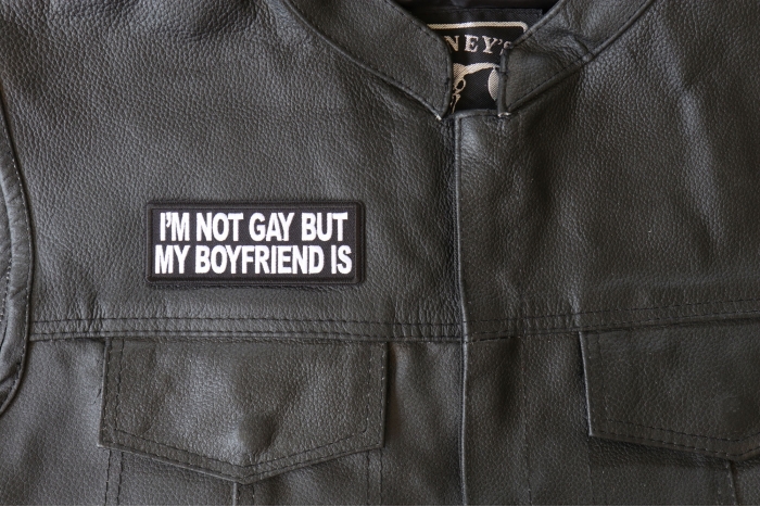 I'm Not Gay but My Boyfriend Is Patch - 4x1.5 inch - Embroidered Iron on Patch shown on leather vest