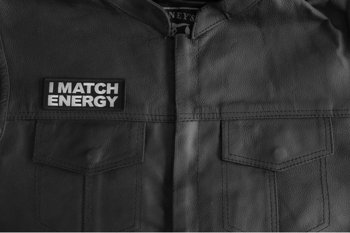 I Match Energy Patch shown on leather vest