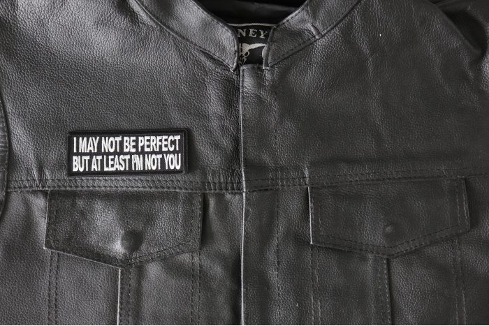 I May Not Be Perfect but At Least I'm Not You Patch - 4x1.5 inch - Embroidered Iron on Patch shown on leather vest
