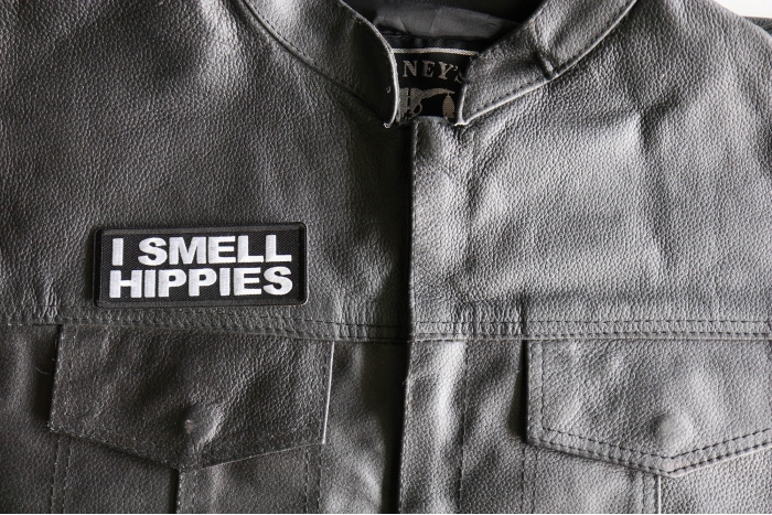 I Smell Hippies Patch - Iron on or Sew on Patch for Hats and Clothes shown on leather vest
