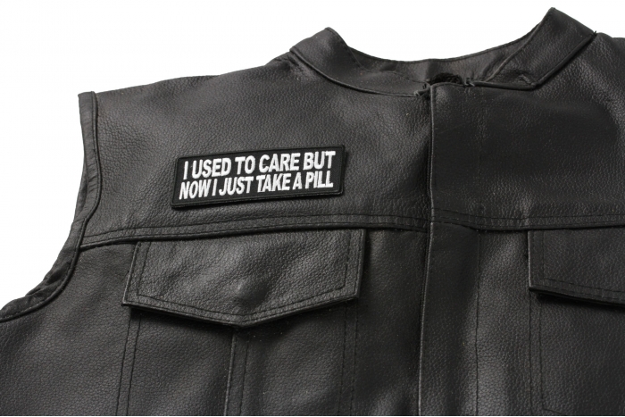 I Used To Care But Now I Take A Pill Patch - 4x1.5 inch. Embroidered Iron on Patch shown on leather vest