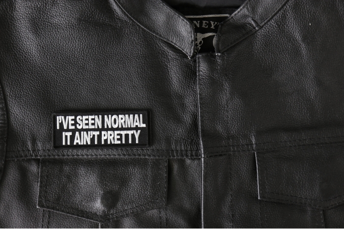 I've Seen Normal It Ain't Pretty Patch - 4x1.5 inch - Embroidered Iron on Patch shown on leather vest