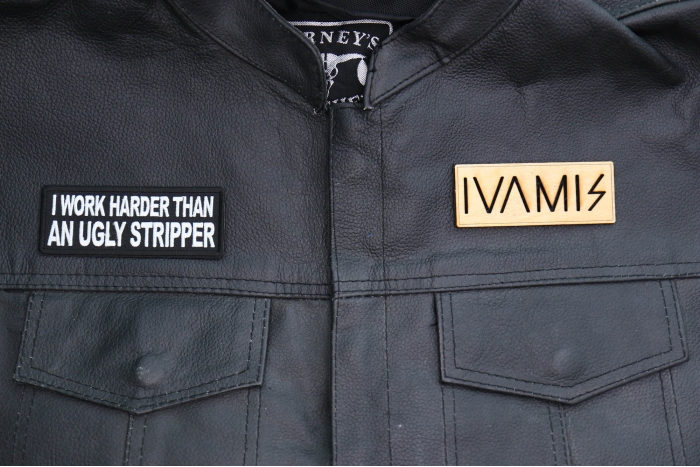I Work Harder than an Ugly Stripper Patch shown on leather vest