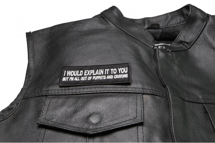 I Would Explain It to You But I'm All Out of Puppets and Crayons Patch - 4x1.5 inch. Embroidered Iron on Patch shown on leather vest