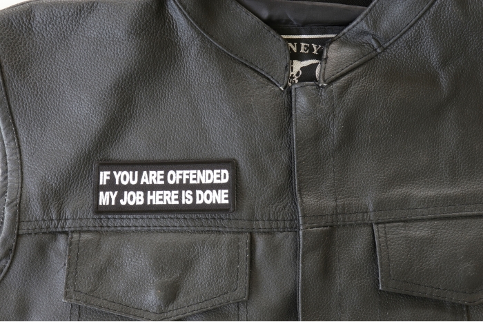 If You are Offended My Job Here is Done Patch - 4x1.5 inch. Embroidered Iron on Patch shown on leather vest