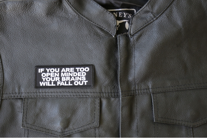 If You are too Open Minded Your Brains Will Fall Out Patch - 4x1.5 inch - Embroidered Iron on Patch shown on leather vest