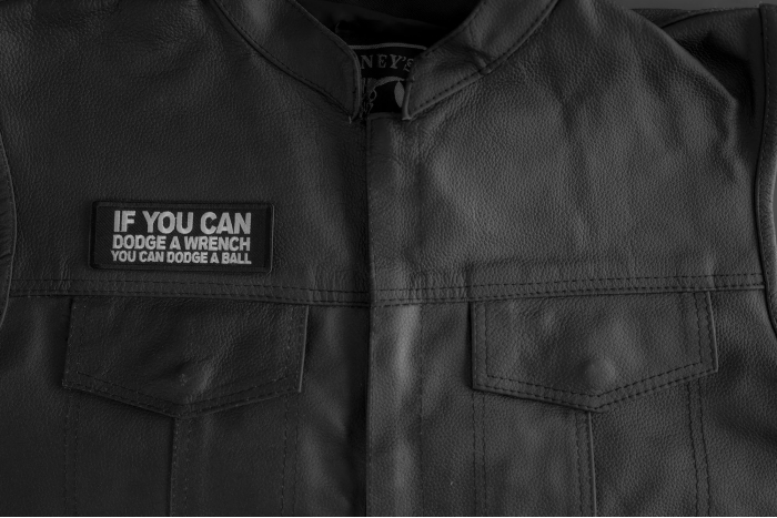 If You Can Dodge A Wrench You Can Dodge A Ball Patch shown on leather vest