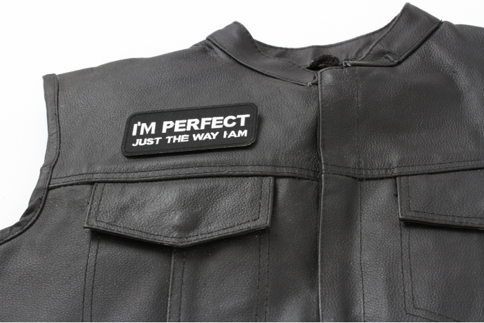 I'm Perfect Just The Way I Am Patch - 4x1.75 inch. Embroidered Iron on Patch shown on leather vest