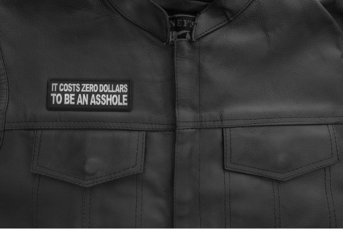It costs zero dollars to be an asshole Patch shown on leather vest