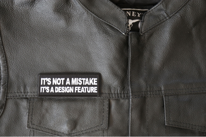 It's Not a Mistake It's a Design Feature Patch, Funny Saying Patches shown on leather vest